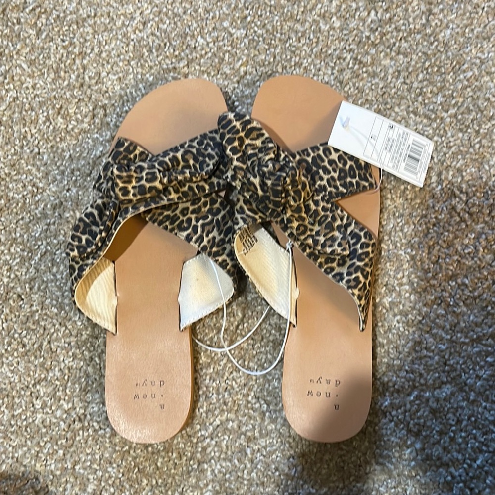 Brand new, with tags. Size 7.5 Cheetah Sandals